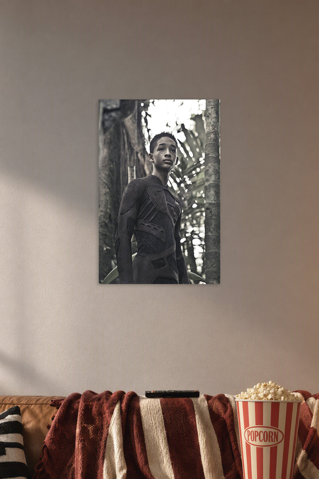 Jaden Smith After Earth in a cozy movie room above a brown sofa with popcorn.