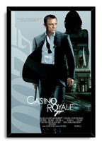 Casino Royale framed wall art print featuring Daniel Craig as James Bond with a pistol, casino building silhouette, and silver car.