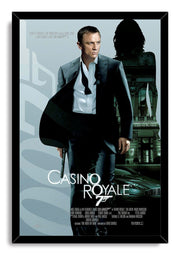 Casino Royale framed wall art print featuring Daniel Craig as James Bond with a pistol, casino building silhouette, and silver car.