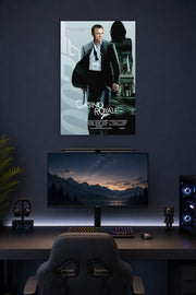 James Bond (Daniel Craig) Casino Royale in a gaming desk setup above a monitor.