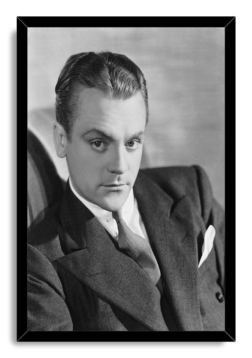 James Cagney framed wall art print displays a black-and-white portrait of the actor in a suit within a slim black frame.
