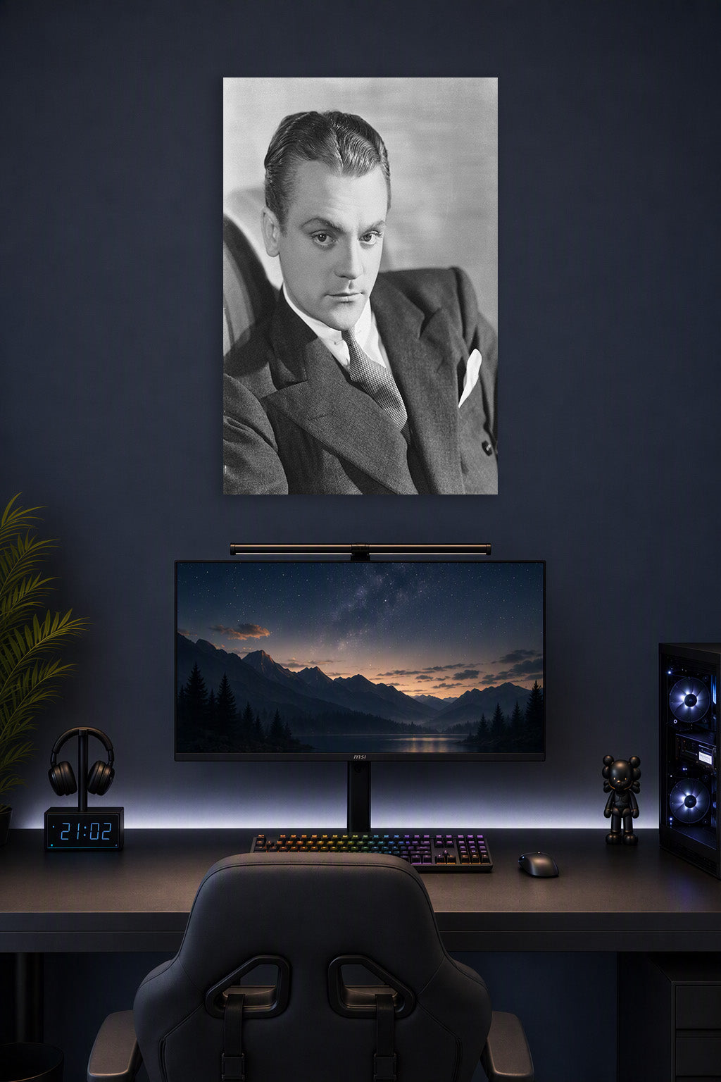 James Cagney in a gaming desk setup above a monitor.