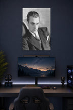 James Cagney in a gaming desk setup above a monitor.