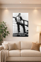 James Dean in a bright living room above a beige sofa.