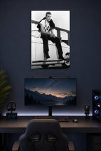 James Dean in a gaming desk setup above a monitor.