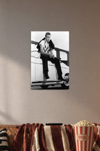 James Dean in a cozy movie room above a brown sofa with popcorn.