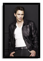 James Franco framed wall art print portrays the actor leaning against a charcoal wall in a leather jacket and white shirt.