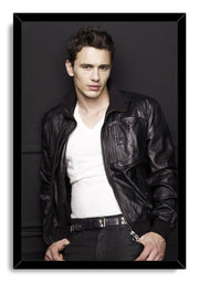 James Franco framed wall art print portrays the actor leaning against a charcoal wall in a leather jacket and white shirt.