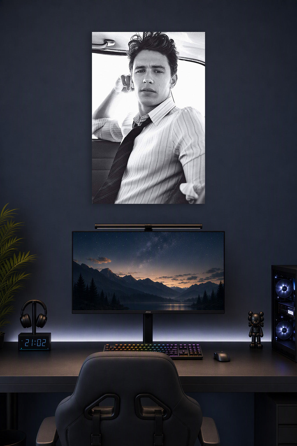 James Franco in a gaming desk setup above a monitor.