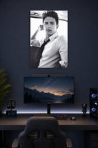 James Franco in a gaming desk setup above a monitor.