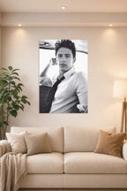 James Franco in a bright living room above a beige sofa.