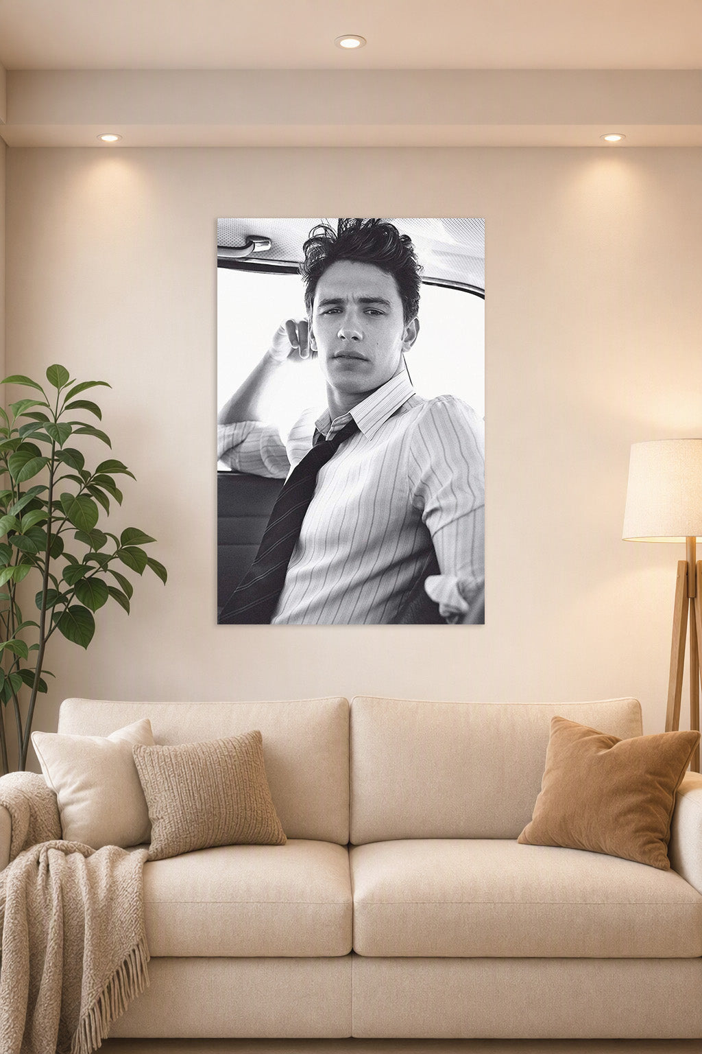 James Franco in a bright living room above a beige sofa.