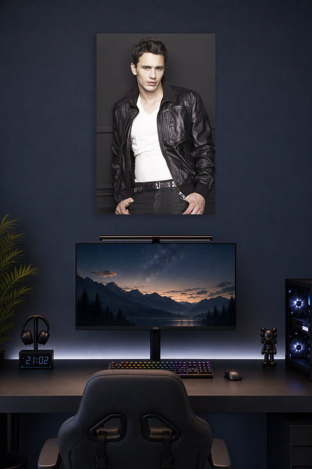 James Franco in a gaming desk setup above a monitor.