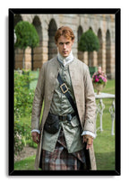 Jamie Fraser framed wall art print presents a red-haired man in tartan and embroidered coat against a garden and arched building.