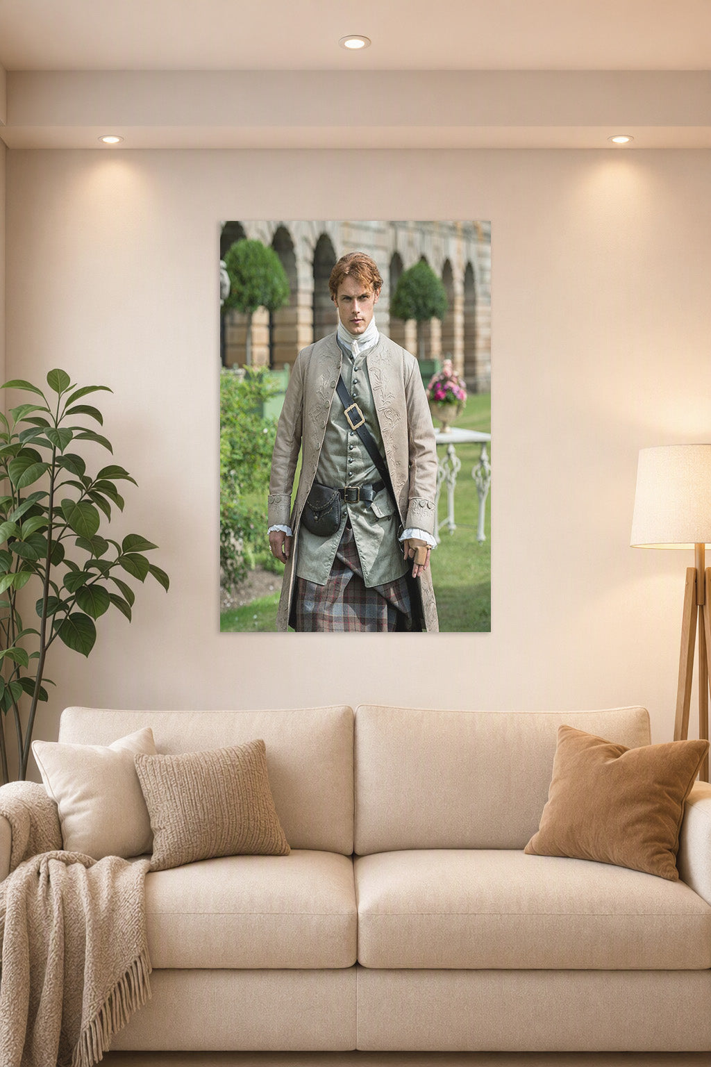 Jamie Fraser Outlander in a bright living room above a beige sofa.