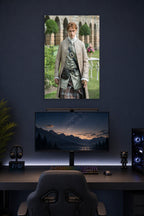 Jamie Fraser Outlander in a gaming desk setup above a monitor.