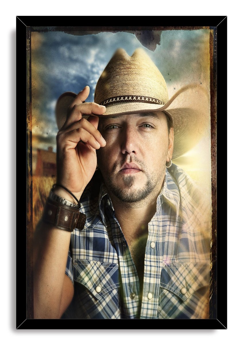 Jason Aldean framed wall art print with a black border, depicting him tipping his cowboy hat in a blue plaid shirt.