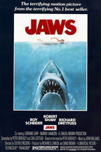 Jaws movie poster wall art with bold red title, a swimmer above a great white shark in blue water, and navy credits border.
