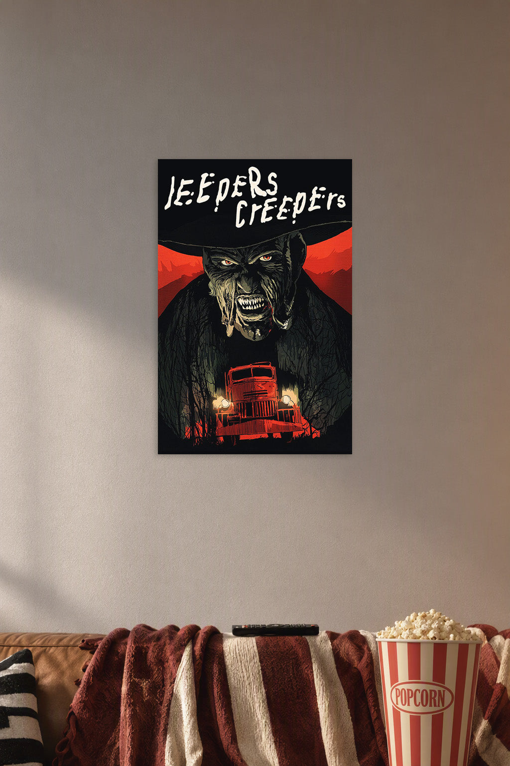 Jeepers Creepers Monster in a cozy movie room above a brown sofa with popcorn.