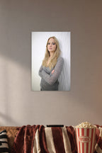 Jennifer Lawrence in a cozy movie room above a brown sofa with popcorn.
