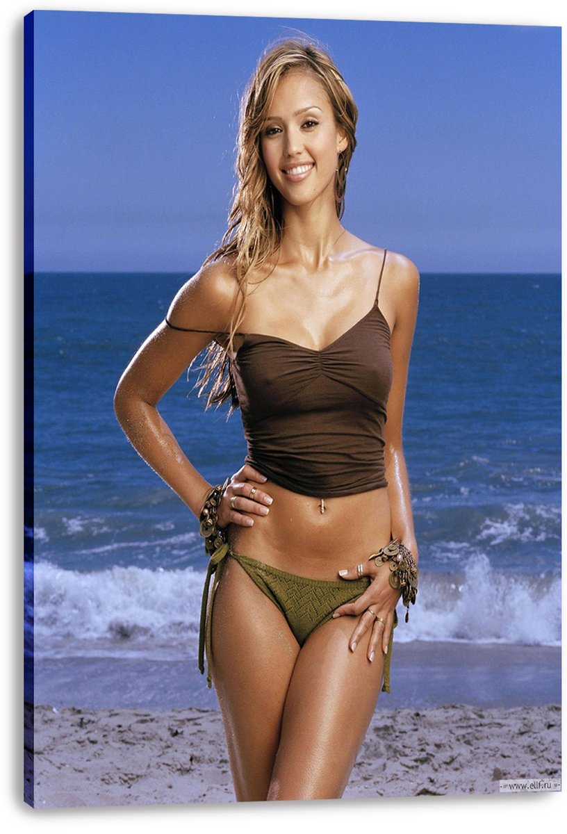 Jessica Alba canvas wall art print displays her smiling in beachwear before blue ocean waves, with the canvas edges visibly wrapped.