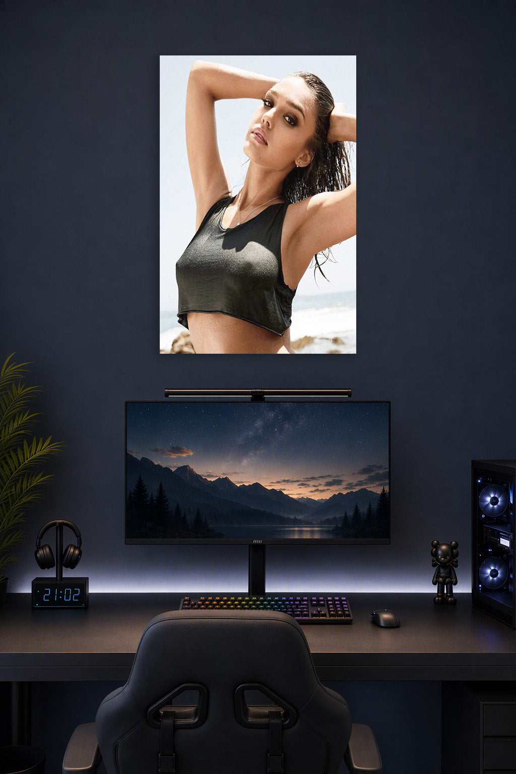 Jessica Alba in a gaming desk setup above a monitor.