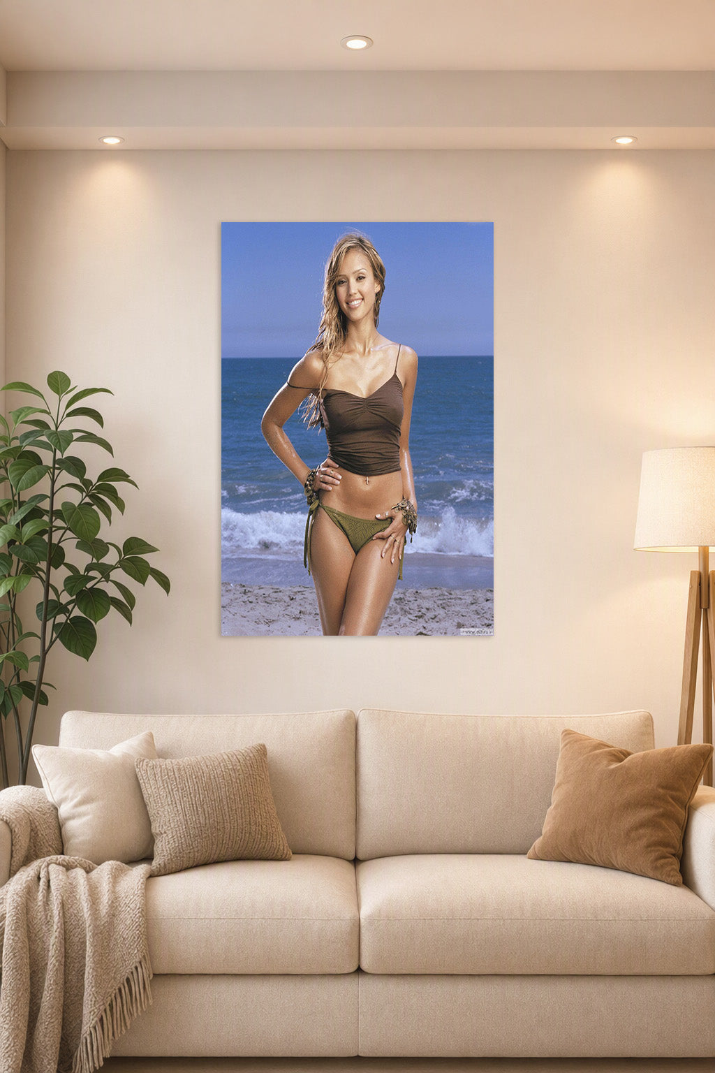 Jessica Alba in a bright living room above a beige sofa.