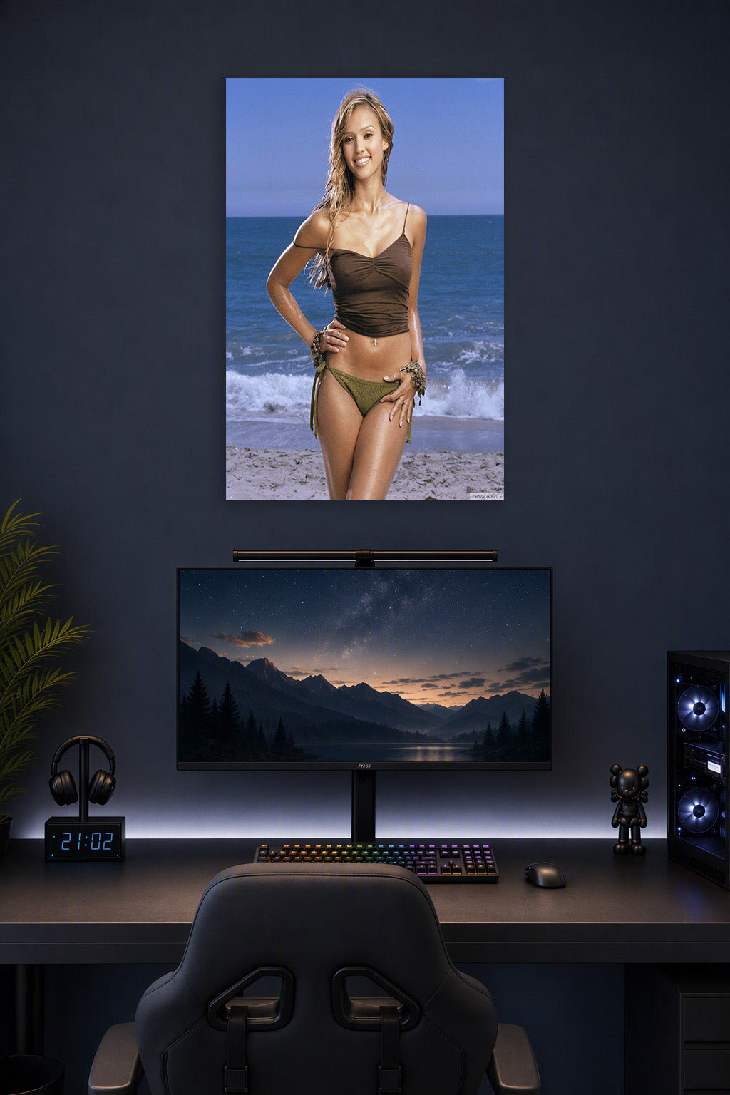 Jessica Alba in a gaming desk setup above a monitor.