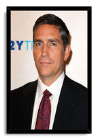 Jim Caviezel framed wall art print with a black border, portraying the actor in a dark suit, white shirt, and red tie.