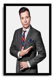 Jimmy Fallon framed wall art print features his gray-suited portrait with a colorful plaid tie inside a black frame.