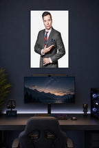 Jimmy Fallon in a gaming desk setup above a monitor.
