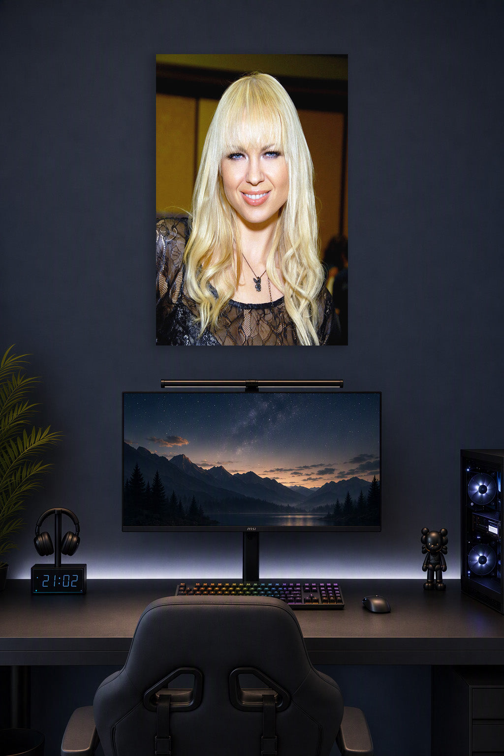 Joanna Angel Portrait in a gaming desk setup above a monitor.