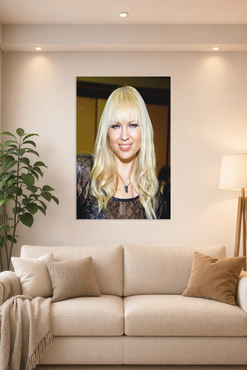 Joanna Angel Portrait in a bright living room above a beige sofa.