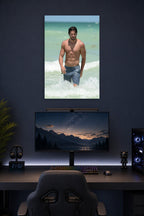 Joe Manganiello in a gaming desk setup above a monitor.
