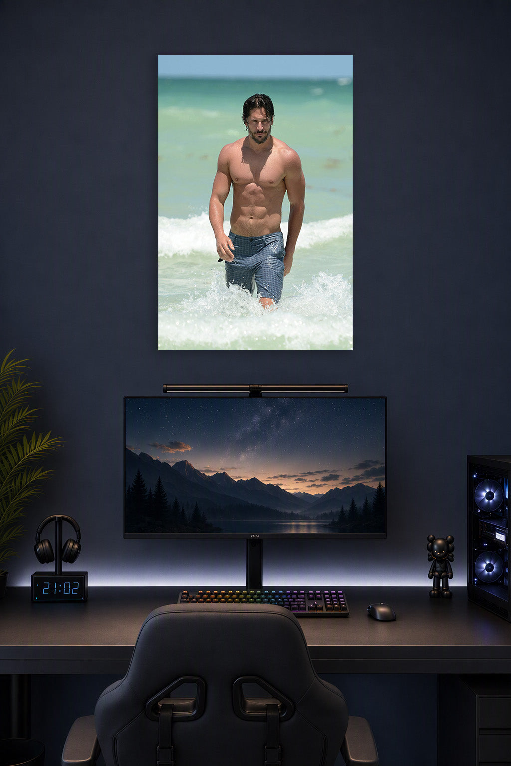 Joe Manganiello in a gaming desk setup above a monitor.