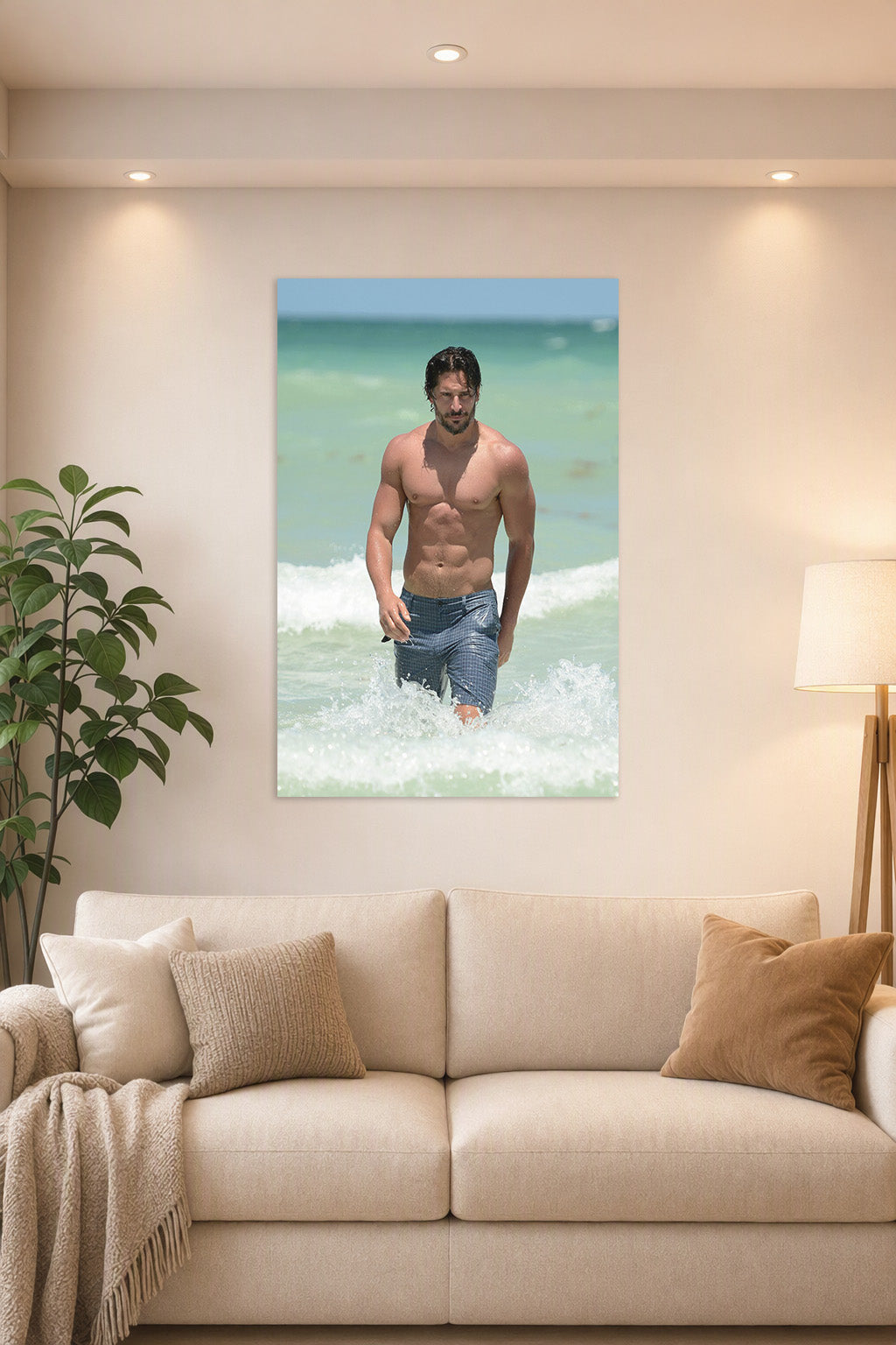 Joe Manganiello in a bright living room above a beige sofa.