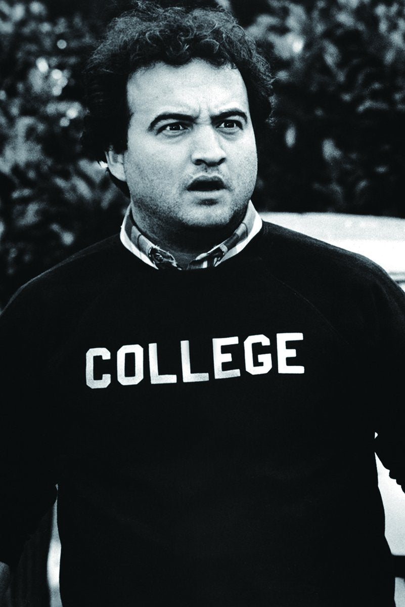 John Belushi as Bluto Blutarsky poster features a black-and-white portrait in a dark COLLEGE sweatshirt.
