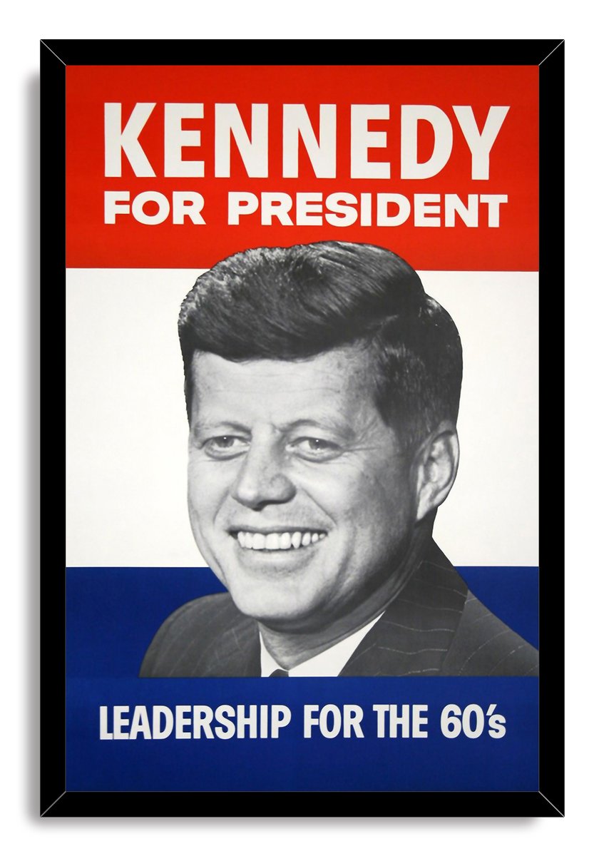 John F. Kennedy campaign poster wall art print in a black frame, with a grayscale smiling portrait and Leadership for the 60's text.