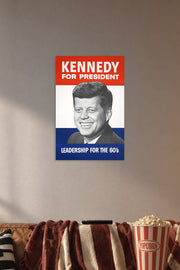 John F. Kennedy JFK Campaign Poster in a cozy movie room above a brown sofa with popcorn.