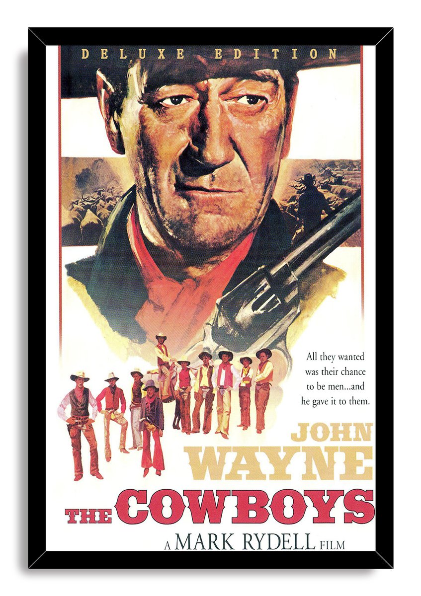 Framed John Wayne The Cowboys poster features a black border around the classic Western portrait, rifle, and young cowboys.