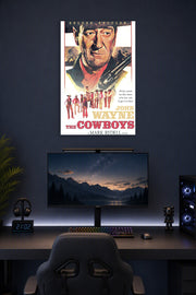 John Wayne The Cowboys Movie in a gaming desk setup above a monitor.