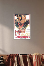 John Wayne The Cowboys Movie in a cozy movie room above a brown sofa with popcorn.