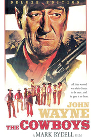 John Wayne The Cowboys poster features a close-up cowboy portrait, rifle, young riders, and bold red Western title text.