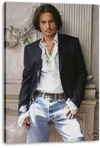 Johnny Depp canvas wall art print displays a full-length portrait in a dark jacket, layered necklaces, white shirt and faded jeans.