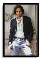 Johnny Depp framed wall art print features a full-length portrait of the actor in casual tailored clothes within a black frame.