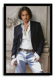 Johnny Depp framed wall art print features a full-length portrait of the actor in casual tailored clothes within a black frame.