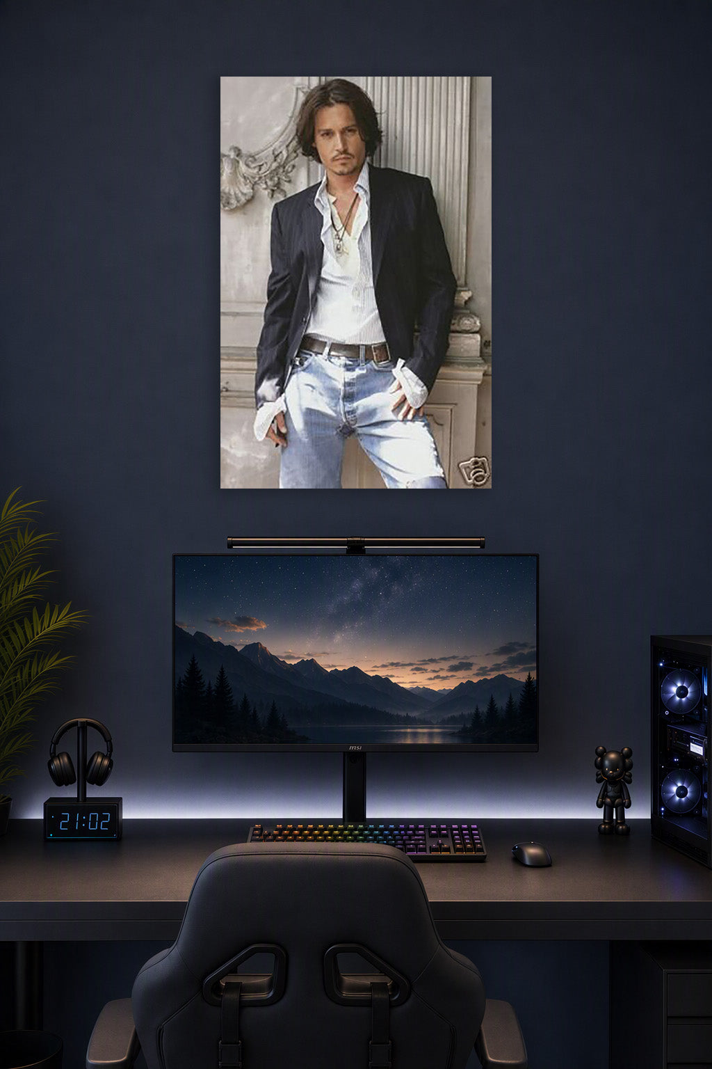 Johnny Depp in a gaming desk setup above a monitor.