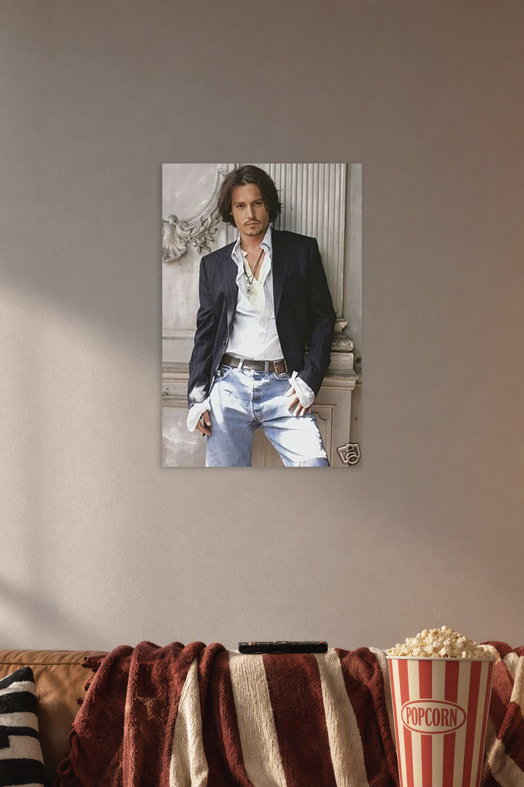 Johnny Depp in a cozy movie room above a brown sofa with popcorn.