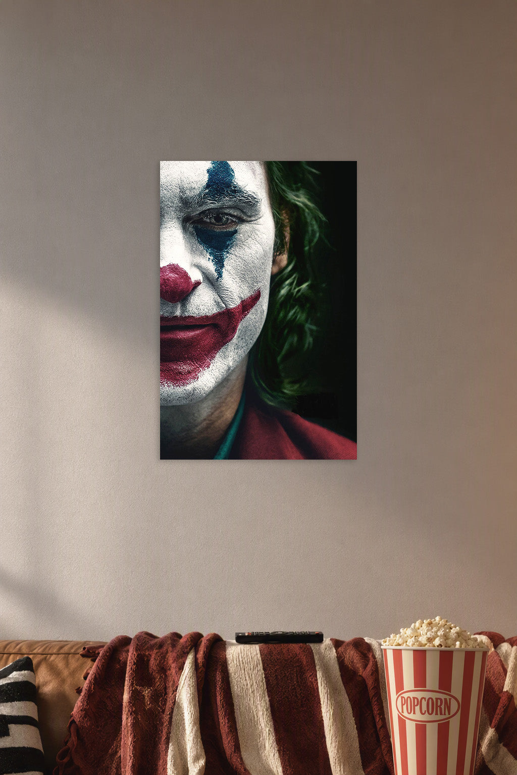 Joker in a cozy movie room above a brown sofa with popcorn.