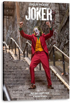 Joker canvas wall art print displays Joaquin Phoenix dancing with raised arms on a stairway, with bold white title text.